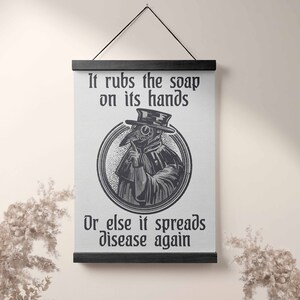 May include: Black and white illustration of a plague doctor with a long beak mask. The text reads "It rubs the soap on its hands or else it spreads disease again."