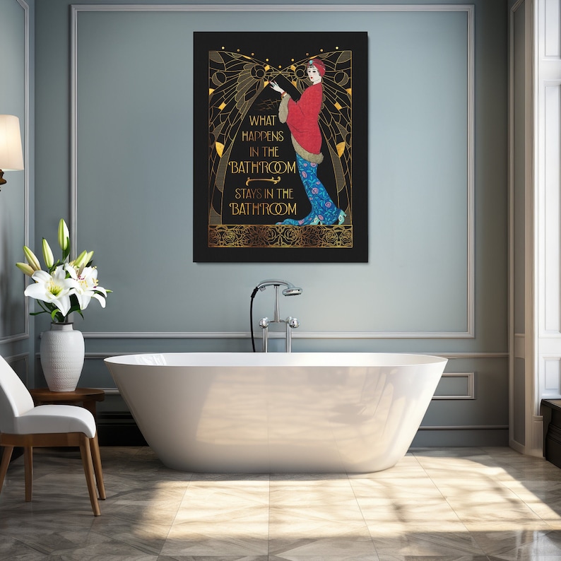 May include: A black and gold art print with a woman in a red and blue dress. The text on the print reads "What happens in the 'bathroom' stays in the 'bathroom'".