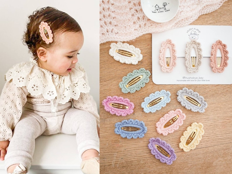 May include: A set of 10 crocheted hair clips in various pastel colors, including pink, blue, green, and yellow. The clips are oval-shaped with a scalloped edge and feature a gold metal bar. The text "#hushabye_bay handmade with love for your little loves" is printed on a white card.