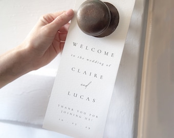 May include: White wedding welcome sign with black text that reads "Welcome to the wedding of Claire and Lucas Thank you for joining us! 10.25.29"