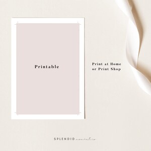 May include: A printable design with the word "Printable" in the centre. The design is a soft pink colour, framed by a white border. The text "Print at Home or Print Shop" is on the right. A white ribbon is in the background.