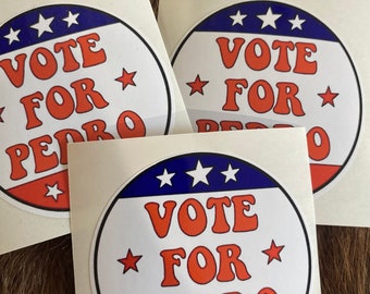 May include: Three white stickers with red, white, and blue circular designs. The stickers have the text "VOTE FOR PEDRO" in a retro font.