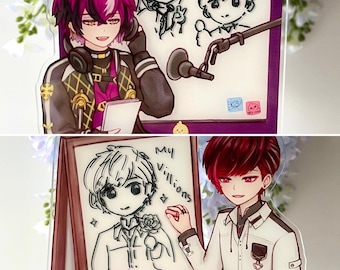 Könnte beinhalten: Zwei Acryl-Aufsteller mit Illustrationen im Anime-Stil. Einer zeigt eine Figur mit Kopfhörern und einem Notizblock, der andere zeigt eine Figur mit einer Zeichenplatte mit der Aufschrift "My Villions". Beide haben leuchtende Farben und detaillierte Kunstwerke.