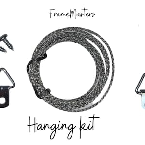 May include: A hanging kit for picture frames, including two D-rings, two screws, and a length of hanging wire. The kit is labeled "Frame Masters Hanging Kit".