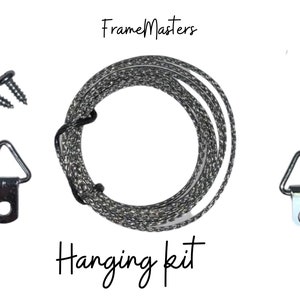 May include: A hanging kit for picture frames, including two D-rings, two screws, and a length of hanging wire. The kit is labeled "Frame Masters Hanging Kit".