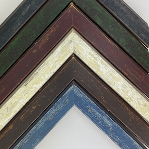 May include: Six different wood picture frames with distressed paint finishes in shades of blue, brown, white, red, green, and black.