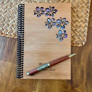 May include: A wooden journal with a spiral binding and a pen. The cover is decorated with a floral design and the text "My Hope is in Jehovah".
