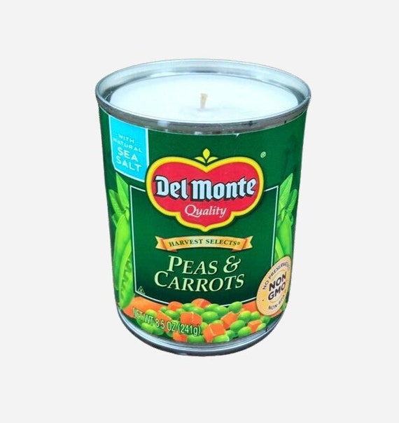 Soy candles poured into upcycled pea and carrot cans — the 'peas and carrots' pun is built right into the vessel itself, zero-waste and actually clever.