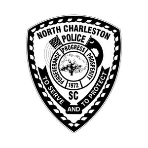 May include: Black and white North Charleston Police badge. The badge features the text "North Charleston Police" and "To Serve and To Protect". The center of the badge has a tree and the words "Perseverance, Progress, Prosperity".