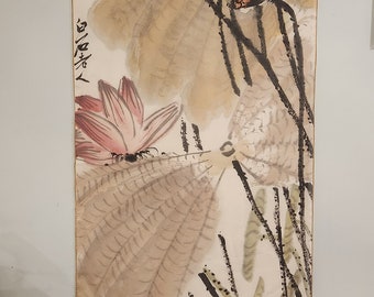 May include: A traditional Chinese painting on silk depicting a bird perched on a branch with lotus pods and leaves. The painting is done in black ink and watercolor on a cream-colored background. The artist's signature is visible in the lower left corner.