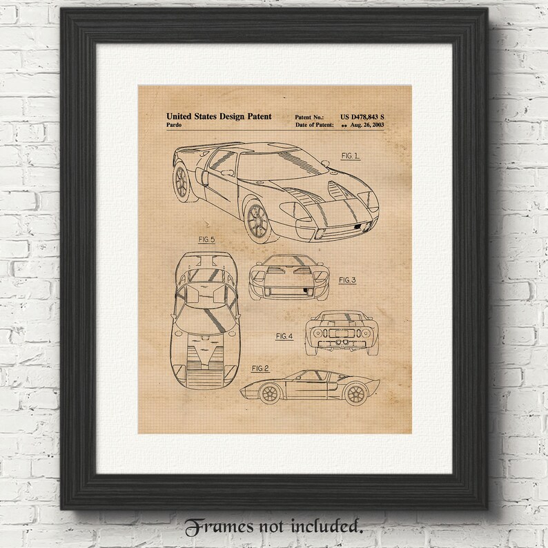 May include: A black and white line drawing of a Ford GT40 race car design patent. The patent number is US D478,843 S and the date of the patent is August 26, 2003. The drawing shows the car from different angles, including the front, side, and top views.