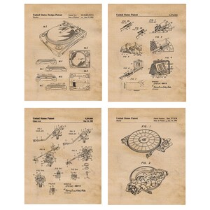 May include: Four vintage black and white patent drawings of a turntable. The drawings show different angles and details of the turntable's design. The drawings are on a beige background with a grid pattern.