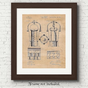 May include: A framed print of a vintage patent illustration for a device, likely a pepper mill. The print features detailed technical drawings in black ink on a tan background, with the text "R.A. Parker" and "Patented Dec. 10, 1901". The frame is dark brown.