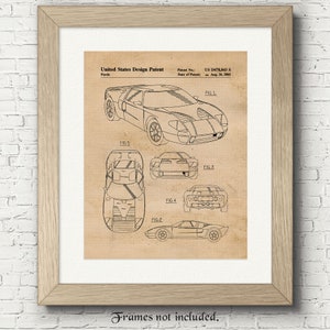 May include: A black and white line drawing of a Ford GT40 race car design patent. The patent number is US D478,843 S and the date of patent is Aug. 26, 2003. The drawing shows the car from different angles.
