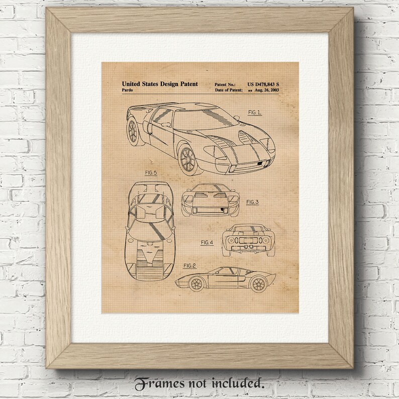 May include: A black and white line drawing of a Ford GT40 race car design patent. The patent number is US D478,843 S and the date of patent is Aug. 26, 2003. The drawing shows the car from different angles.