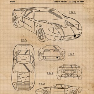May include: A black and white line drawing of a Ford GT40 race car. The drawing shows the car from five different angles: front, side, rear, top, and bottom. The drawing is on a gridded background with the text "United States Design Patent" and "US D478,843 S" at the top.