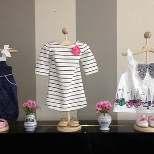 Clothing vendors shop for children's boutiques