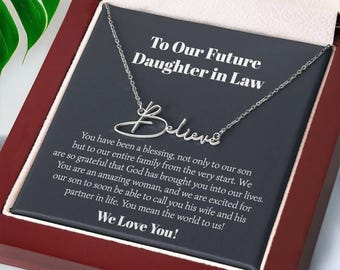 May include: A silver-colored necklace with the word "Believe" in cursive script, presented in a gift box. The box contains a message to a future daughter-in-law, expressing love and gratitude. The background is a dark gray card.
