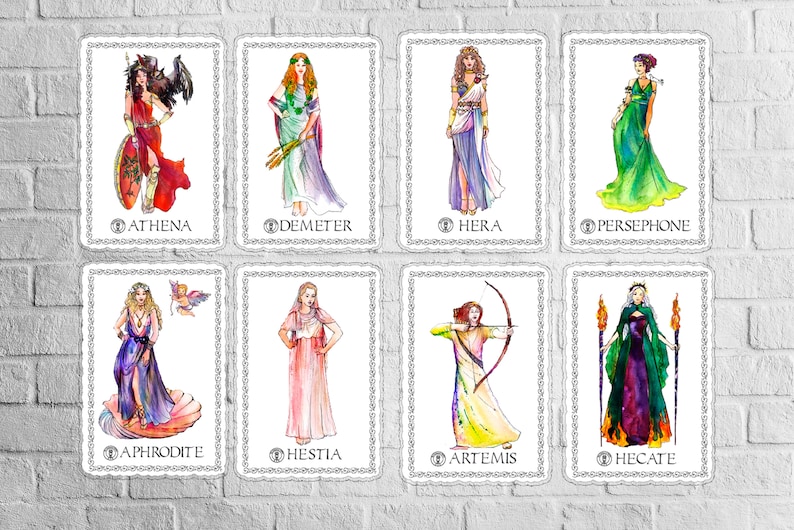 May include: A set of eight illustrated cards featuring the Greek Goddesses Athena, Demeter, Hera, Persephone, Aphrodite, Hestia, Artemis, and Hecate. Each card has a white background with a decorative border and the name of the goddess at the bottom.