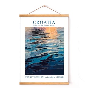 May include: A digital illustration of a sunset over a body of water in Croatia. The water is a deep blue with ripples and reflections of the orange and yellow sunset. The text "CROATIA" is at the top of the image, and the text "Tiha voda brege dere." is below it. The text "SUNSET SESSION, primo&scaron;ten." is at the bottom of the image, along with the text "AUGUST 2021 CINDY TIMMER."