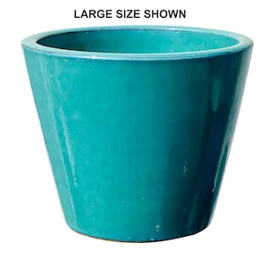 May include: A turquoise ceramic planter with a glossy finish. The planter has a wide opening and tapers down to a smaller base. The text "LARGE SIZE SHOWN" is displayed at the top of the image. Ideal for indoor or outdoor plants.