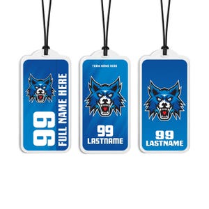 May include: Three rectangular blue luggage tags with black cords, each featuring a graphic of a snarling blue wolf head with a red heart tongue. The tags display the number 99 and text including FULL NAME HERE, TEAM NAME HERE, and LASTNAME.