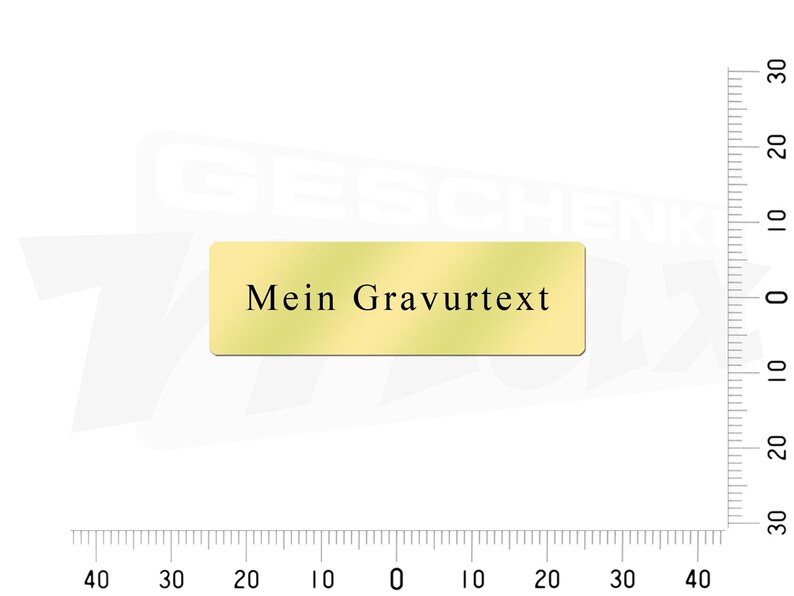 May include: A gold-colored rectangular nameplate with the text "Mein Gravurtext" in black.