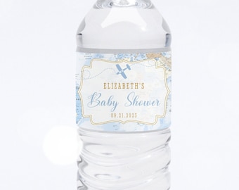May include: A clear plastic water bottle with a blue and gold label that says "Elizabeth's Baby Shower" with a small airplane graphic.