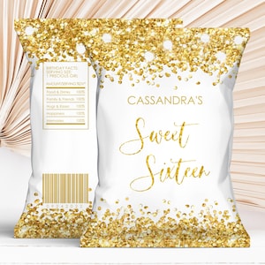 May include: Two white chip bags with gold glitter accents. The bags have the text "Cassandra's Sweet Sixteen" in gold script. One bag has a barcode and a list of birthday facts. The bags are for a sweet sixteen birthday party.