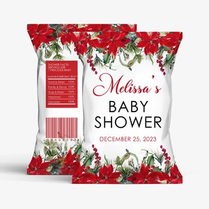 May include: A white chip bag with a red poinsettia and evergreen border. The bag is decorated with the text "Melissa's Baby Shower" and "December 25, 2023".