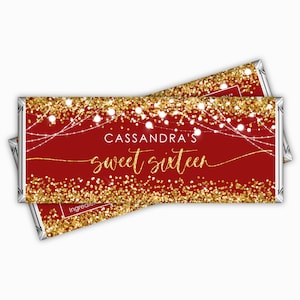 May include: Red and gold chocolate bar wrapper with the text "Cassandra's Sweet Sixteen" and a design of gold glitter and white string lights.