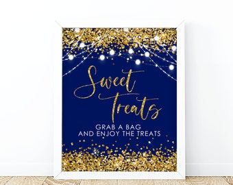 May include: A navy blue sign with gold glitter and white string lights. The sign says "Sweet Treats" and "Grab a bag and enjoy the treats".