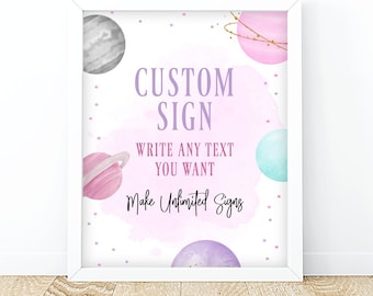 May include: A printable sign with a pink, purple, and blue watercolor background featuring planets and stars. The text on the sign reads "Custom Sign Write Any Text You Want Make Unlimited Signs".