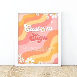 May include: A white frame with a pink and orange background with wavy lines and white daisies. The text "Custom Sign" is in a retro font. The text "Write any text you want Make unlimited signs" is below the main text.