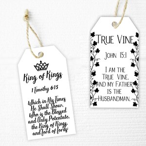 May include: Two white gift tags with black text and images. The first tag says "King of Kings" with a crown and the Bible verse "1 Timothy 6:15". The second tag says "True Vine" with a vine and the Bible verse "John 15:1".