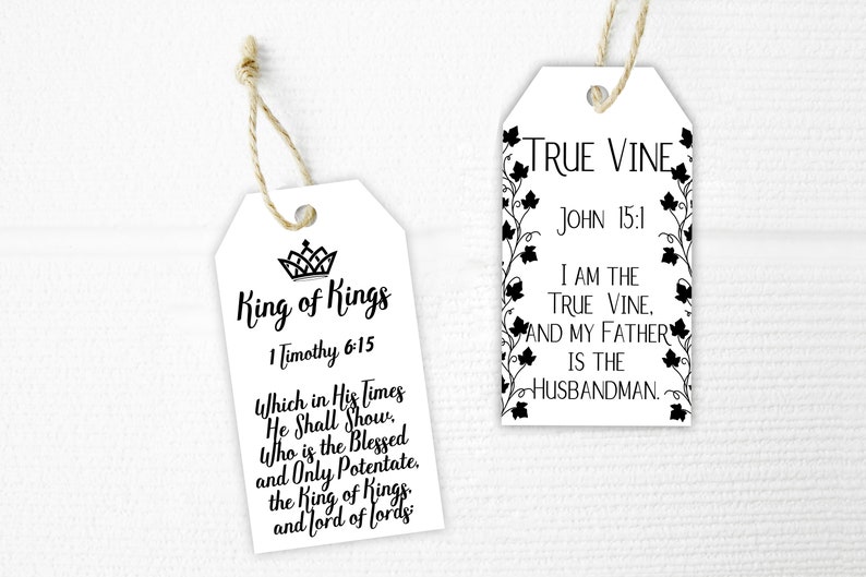 May include: Two white gift tags with black text and images. The first tag says "King of Kings" with a crown and the Bible verse "1 Timothy 6:15". The second tag says "True Vine" with a vine and the Bible verse "John 15:1".