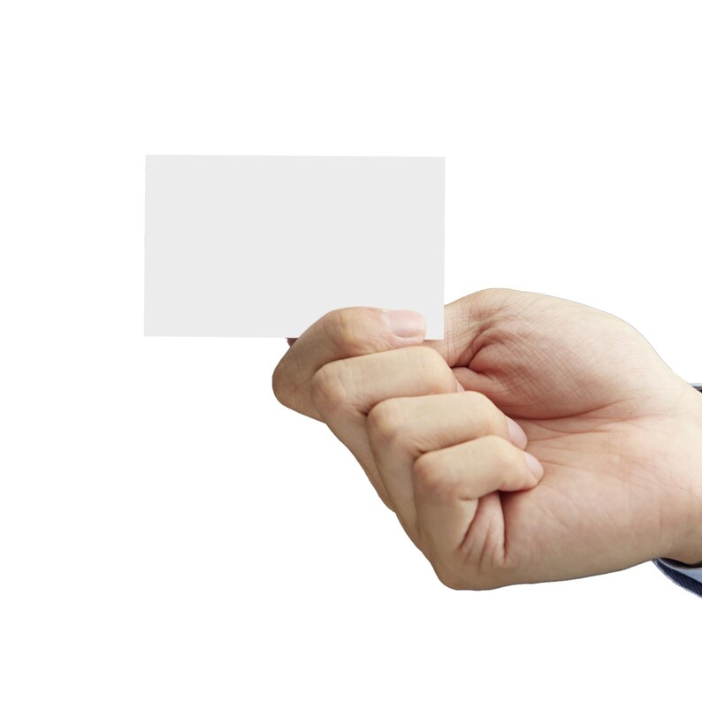 A close-up of a hand holding a blank white business card between the thumb and fingers, set against a plain white background. The card is positioned centrally, ready for customisation.
