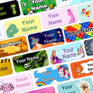 May include: A set of colourful, rectangular name labels with various cartoon illustrations. The labels feature different themes, including space, animals, sports, and fantasy. Each label includes the text "Your Name".