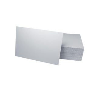 A stack of blank white business cards with one card positioned upright in front, showcasing the card's plain surface against a white background.