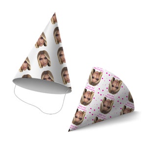 May include: Two white party hats with a repeating pattern of a woman's face. The hats have a pink polka dot pattern and the text "Lauren's Hen July 2024".