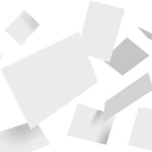 Multiple blank white business cards with varying shadows are scattered against a light grey background, suggesting a dynamic and abstract layout