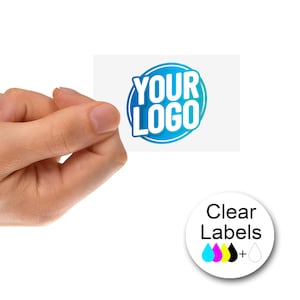 May include: Clear labels with a blue circle that says "YOUR LOGO" in white text. The labels are shown in a hand, and a separate image shows the labels with CMYK ink drops.