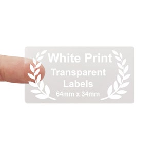 May include: Clear transparent labels with white print. The labels are 64mm x 34mm and feature a laurel wreath design. White Print Transparent Labels.