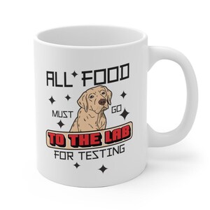 May include: White ceramic mug with a brown labrador retriever illustration and the text "All food must go to the lab for testing".