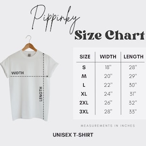 May include: A white unisex t-shirt hanging on a wooden hanger. The image includes a size chart with measurements in inches for sizes S to 3XL. The text "Pippinky" is at the top, and "Size Chart" is displayed.