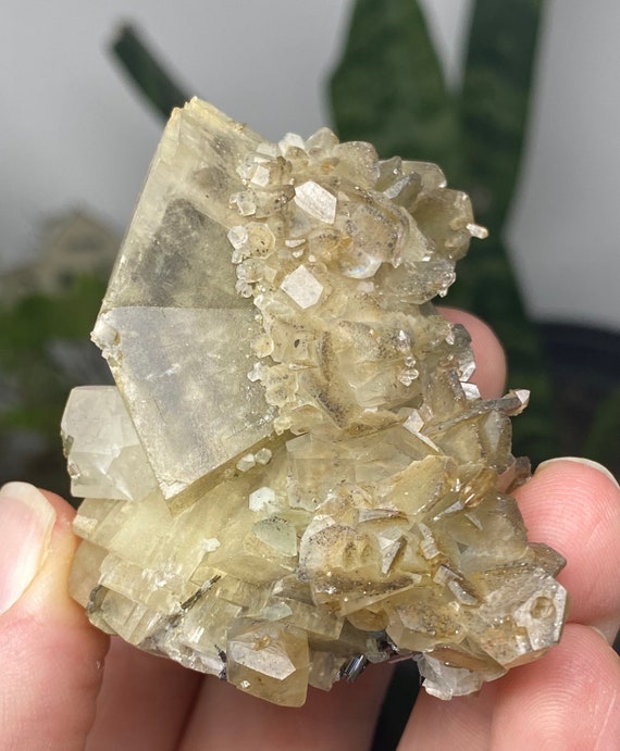 Calcite Cluster with Pyrite Inclusions,  Rutile, and Mica