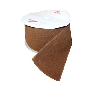 May include: A roll of brown hook and loop tape, also known as Velcro, on a white spool. The tape is a fuzzy, textured material.