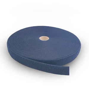 May include: A roll of dark blue hook and loop tape, also known as Velcro, is shown against a white background.