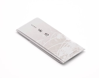 May include: A white box with a floral design and Japanese text that reads "香道" (Incense Way).