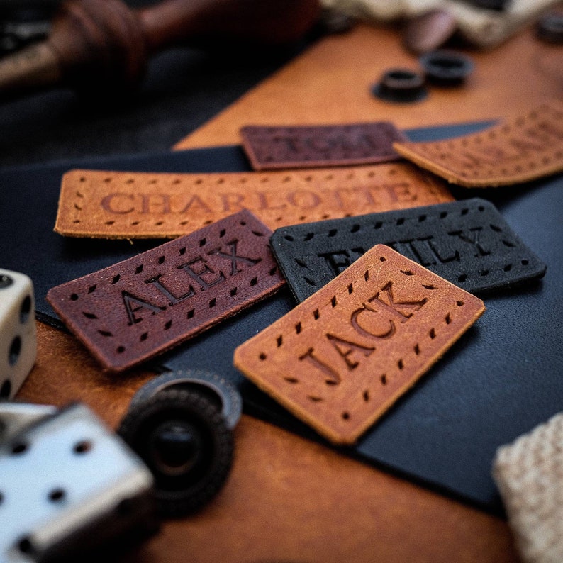 Beautiful small handmade leather label featuring neatly embossed personalisation.